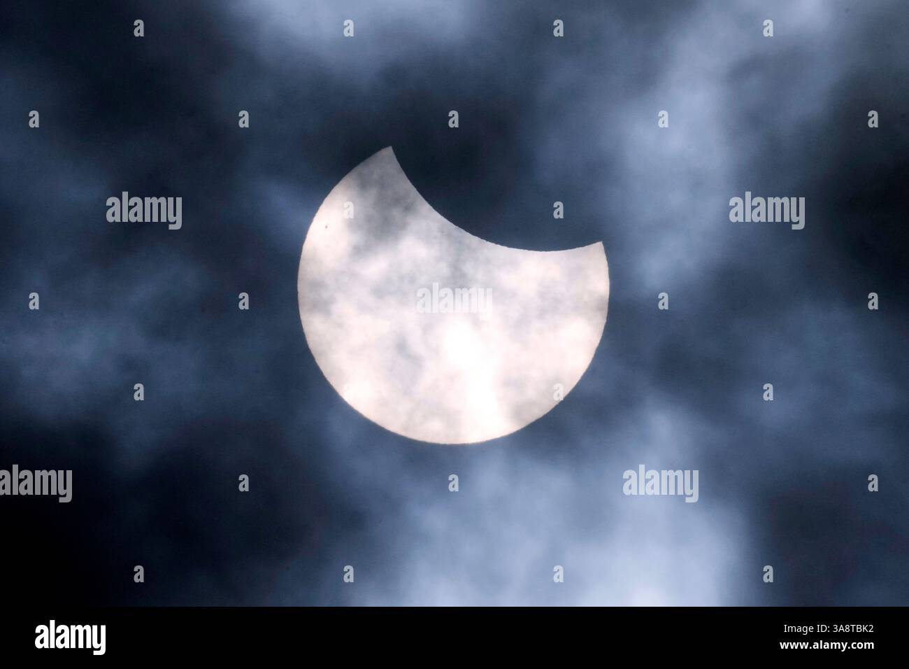 A partial solar eclipse is seen from the city of Gelsenkirchen, Germany ...