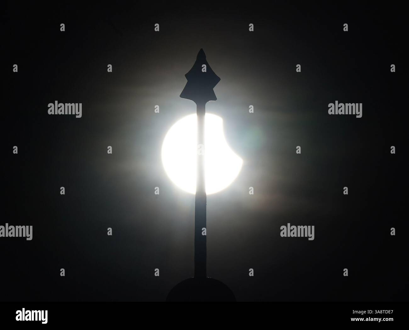 A partial solar eclipse is seen behind the roof of the Greenwich foot ...