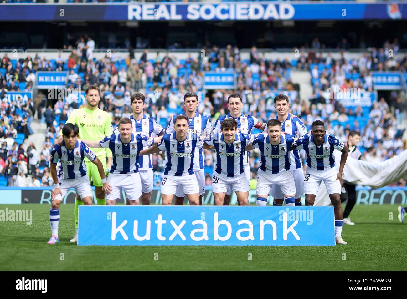 Players of Real Sociedad line up for a team photo during the LaLiga EA ...