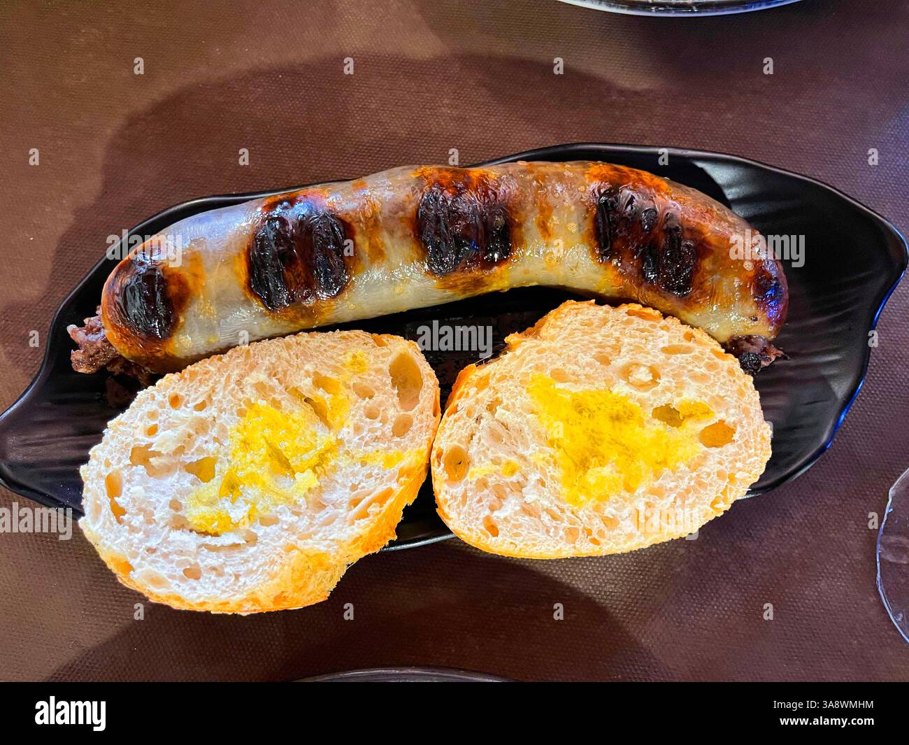 Butifarra with bread and olive oil. Spain. - Smartphone Captured Stock Image