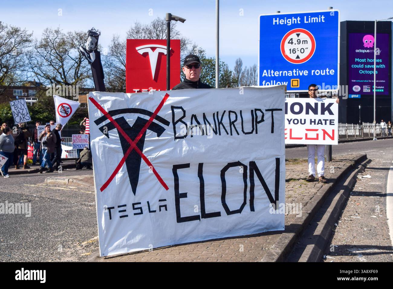 London, UK. 29th March 2025. Protesters gather outside the Tesla Centre ...