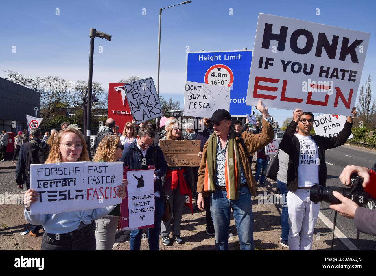 London, UK. 29th March 2025. Protesters gather outside the Tesla Centre ...