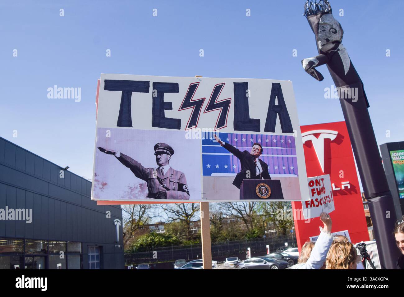 London, UK. 29th March 2025. Protesters gather outside the Tesla Centre ...