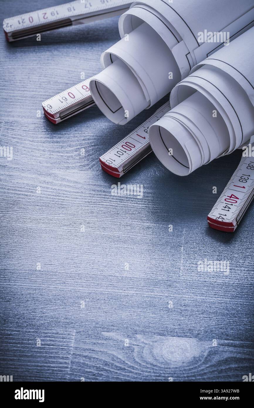 Vertical view two rolls of blueprints on white wooden meter Stock Photo ...