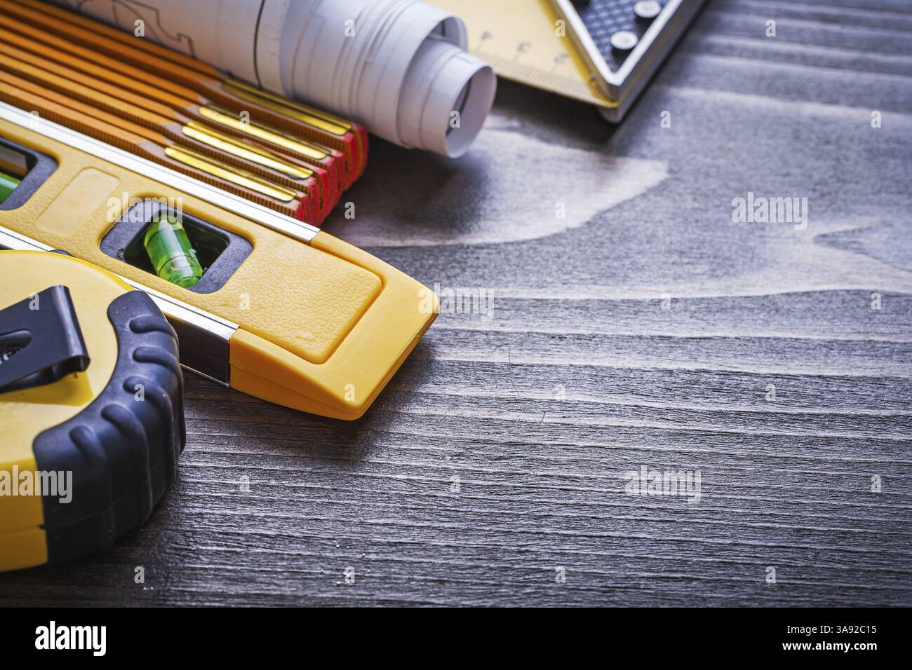 Instruments of measurement blueprints and construction level on vintage ...