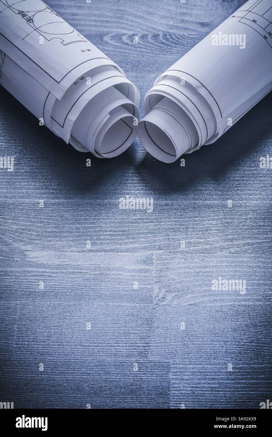 Vertical view view on two white rolls of blueprints Stock Photo - Alamy