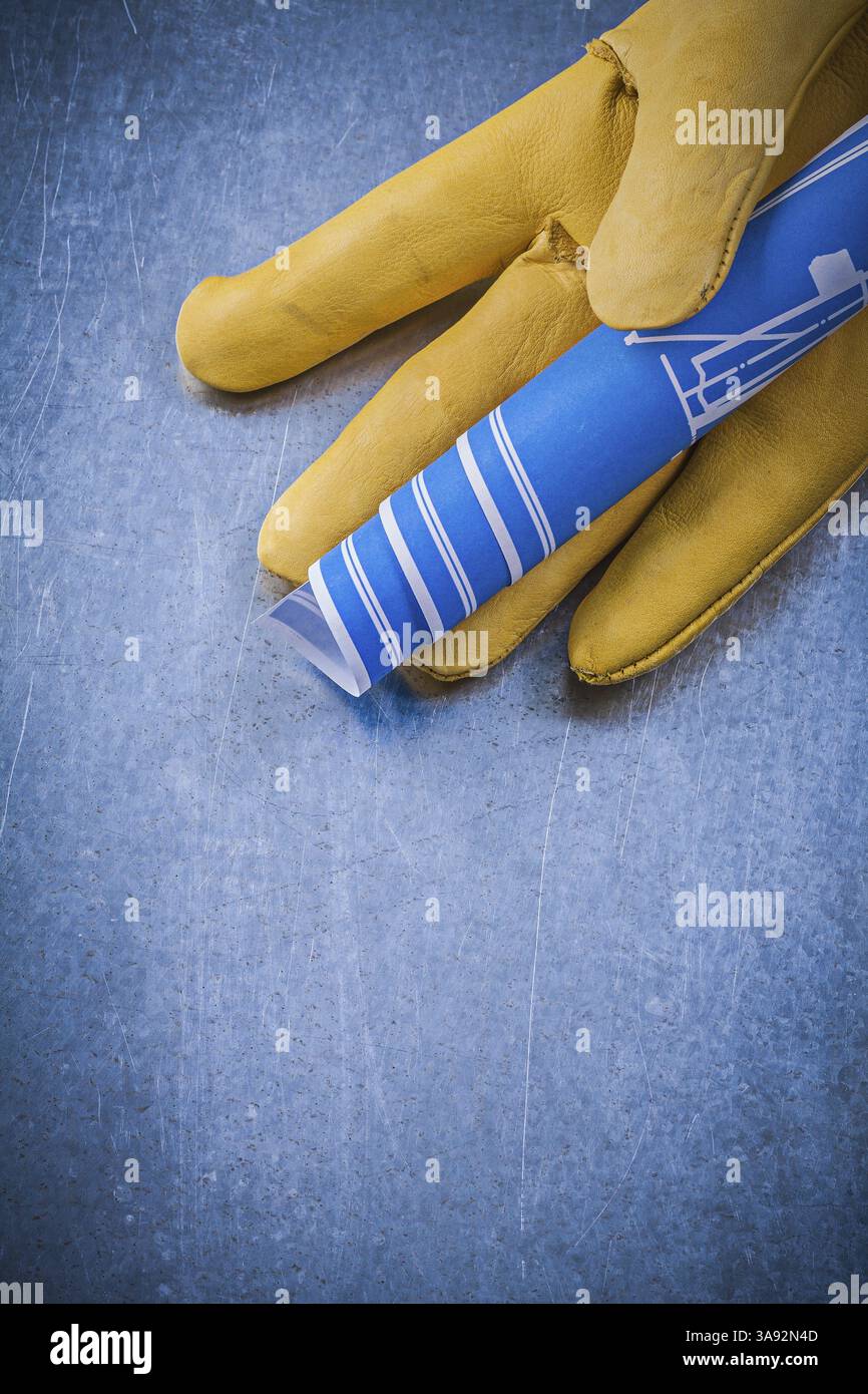Leather safety gloves blue engineering drawings on metallic background ...