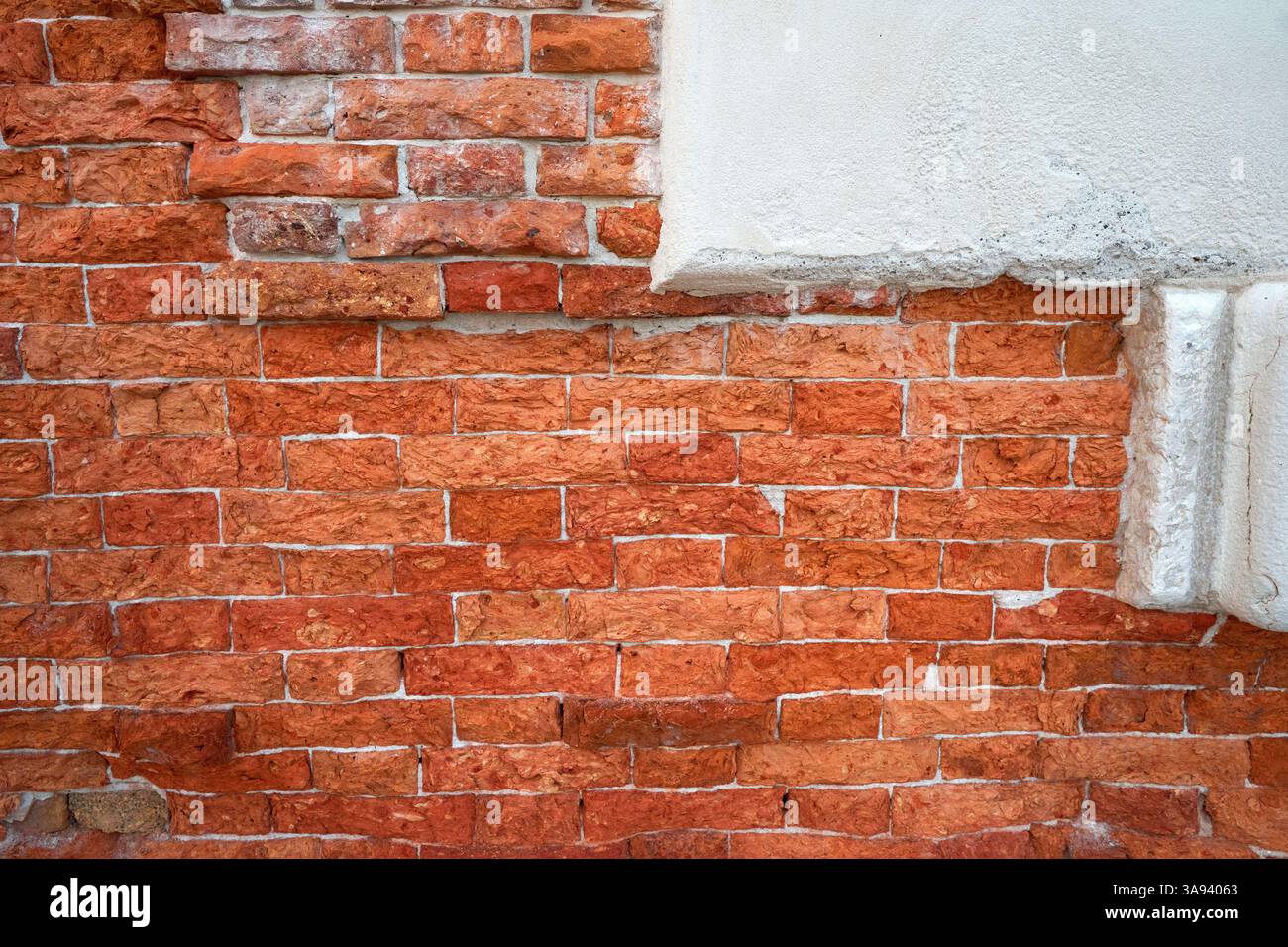 Old red brick background at natural light Stock Photo