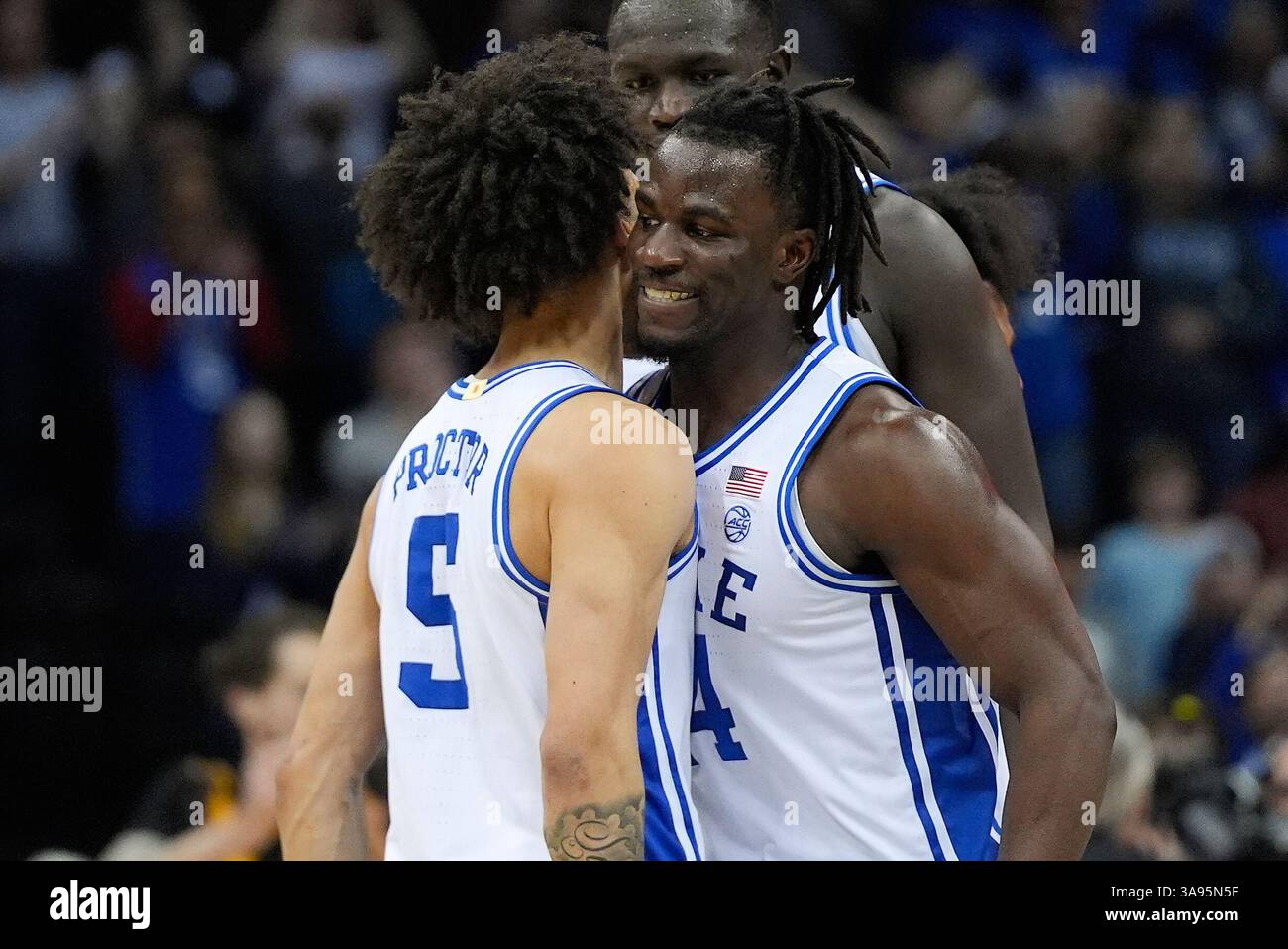 Duke guard Sion James (14) celebrates with Duke guard Tyrese Proctor (5