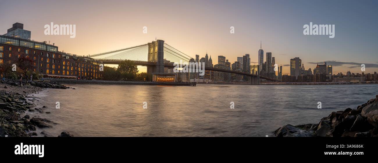 Panorama of the famous Brooklyn Bridge in New York City after sunset ...