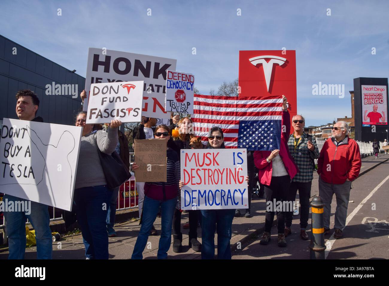 London, UK. 29th March 2025. Protesters gather outside the Tesla Centre ...