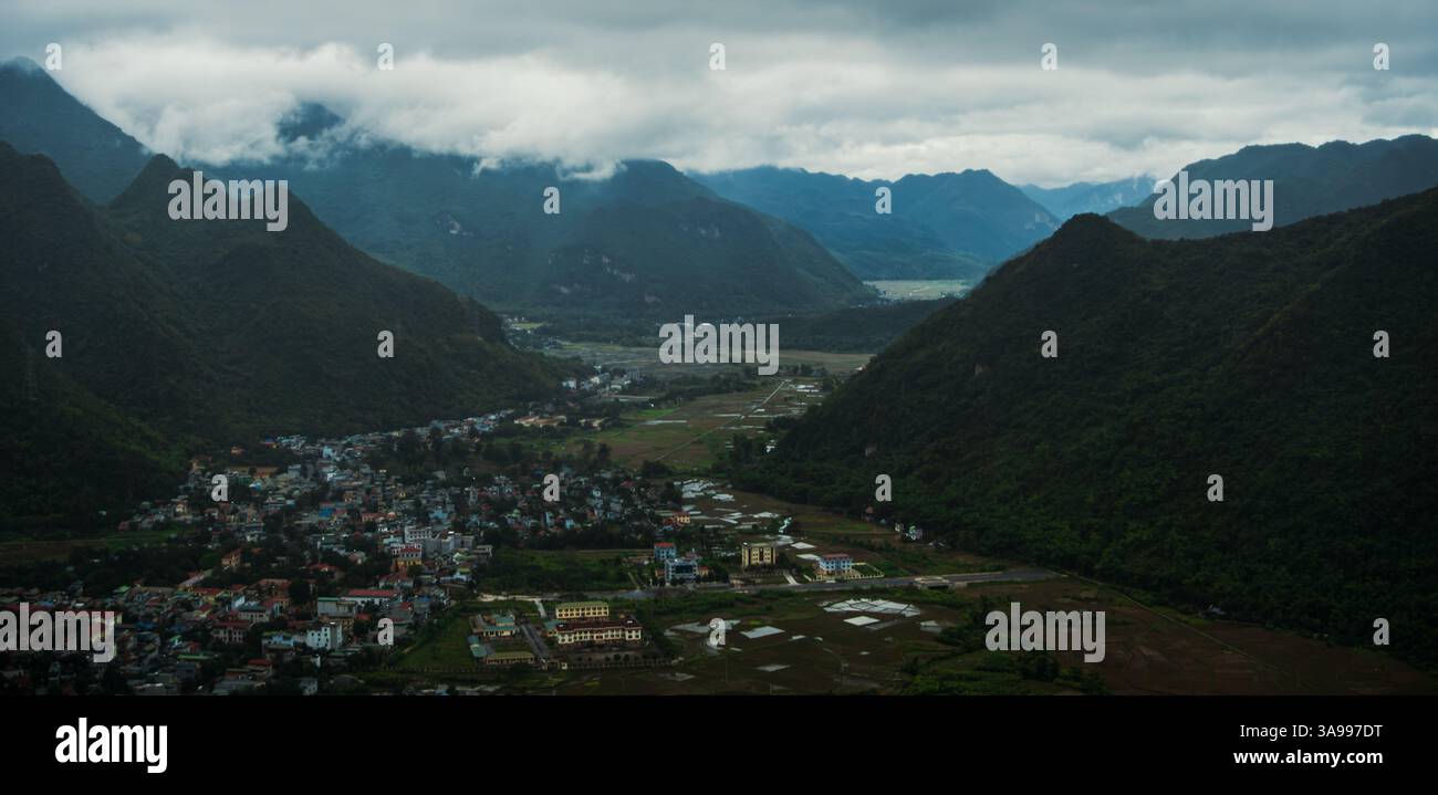 Misty mountains surround the lush valleys of Hoa Binh City and Mai Chau, Vietnam Stock Photo