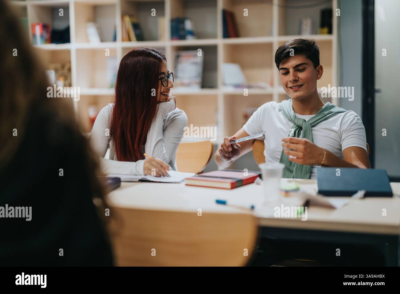 Engaged students collaborating during an interactive classroom study session Stock Photo