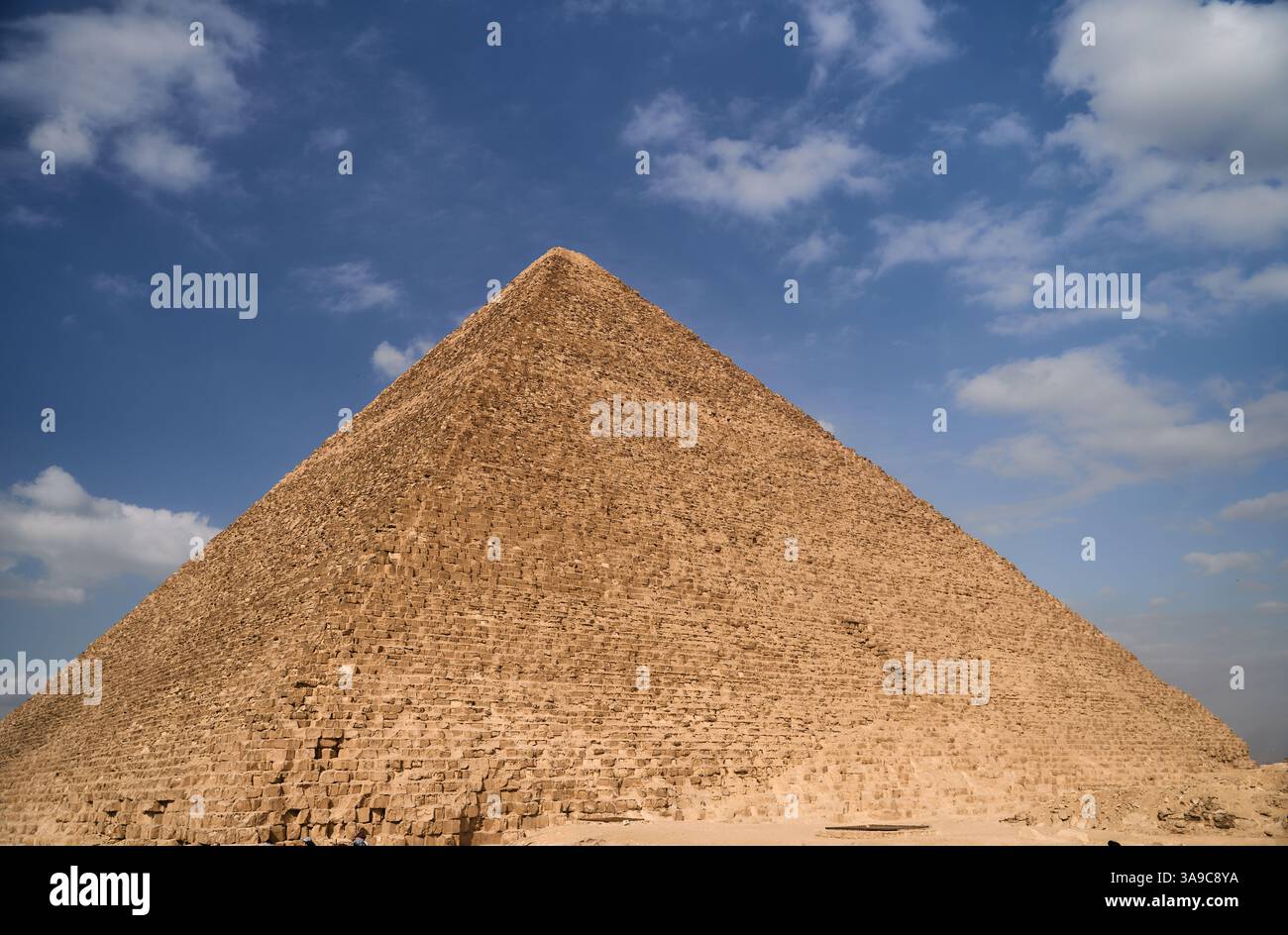 The Majestic Pyramids of Giza Stand Tall Against a Dramatic, Cloudy Sky ...