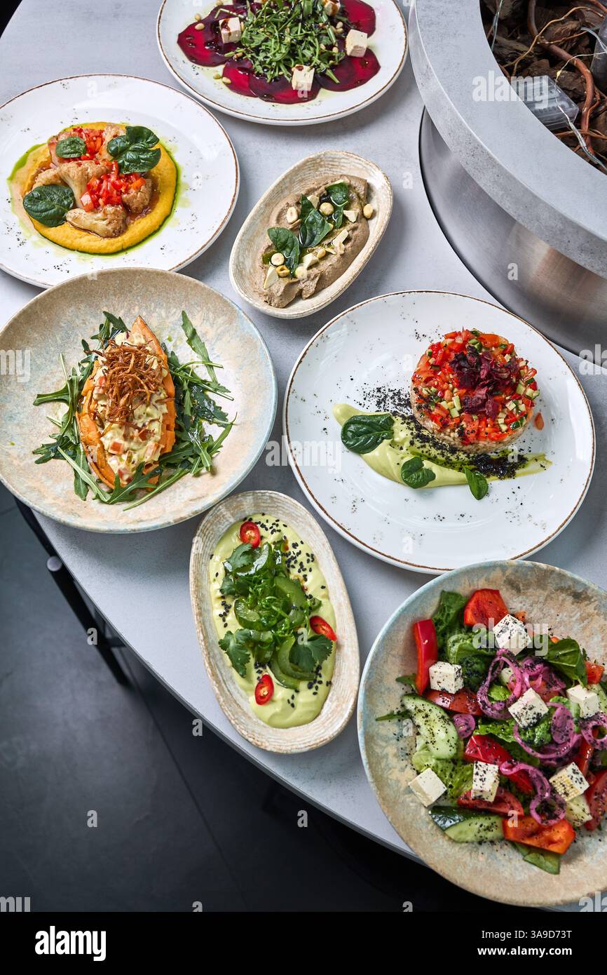 Assorted Gourmet Vegan Dishes on Elegant Table Stock Photo