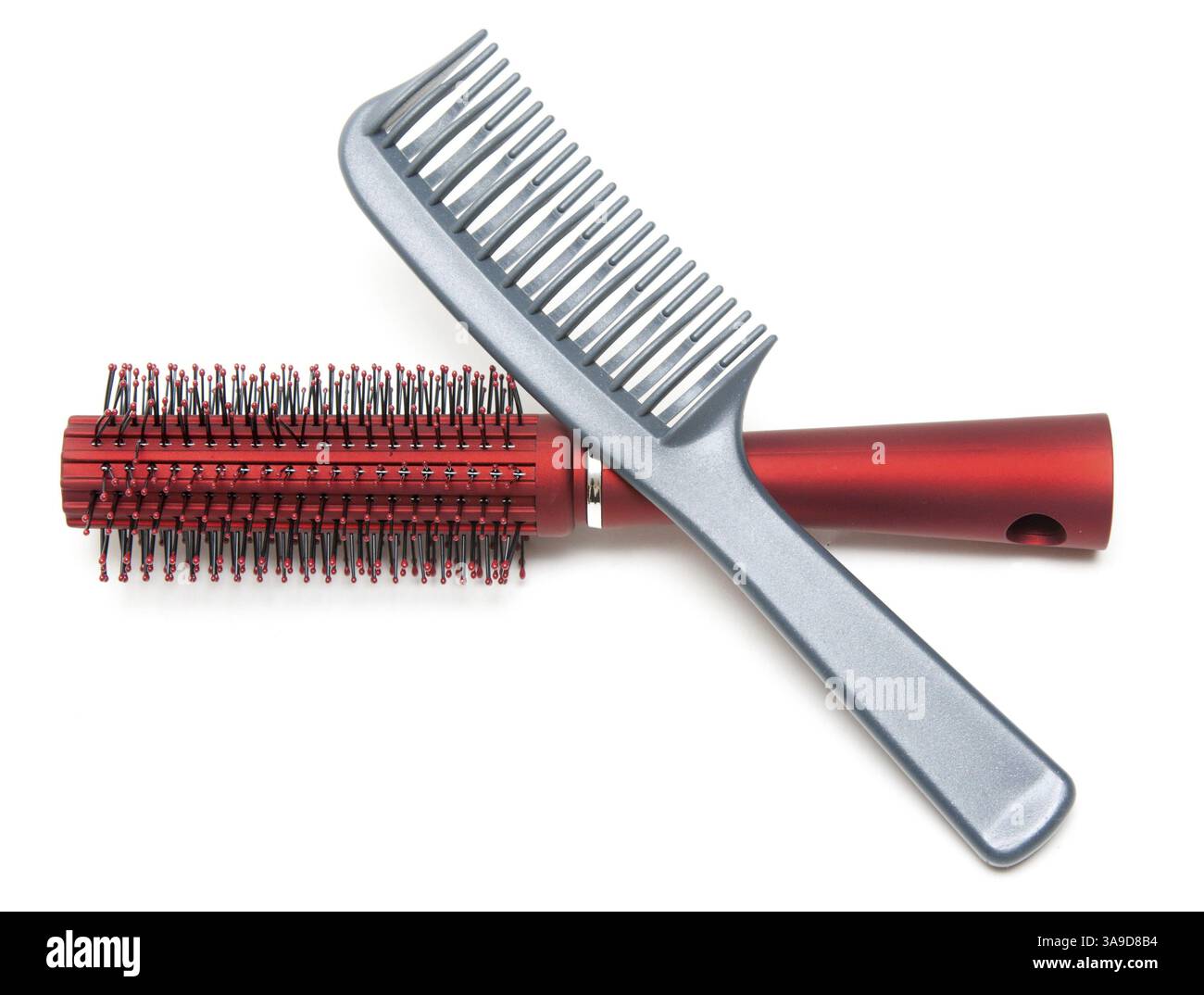 Two combs, red and sulfuric insulated on white background Stock Photo