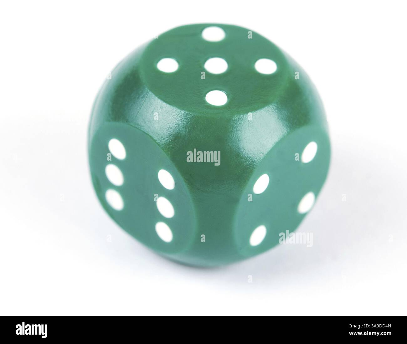 Green plastic dice isolated on a white background Stock Photo