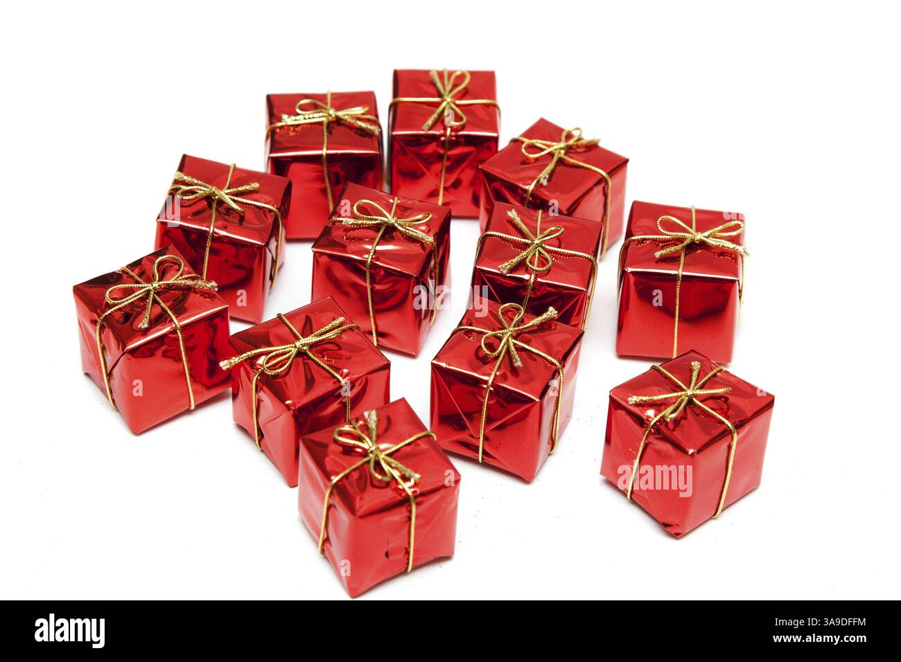 Gift red boxes with gold bows on a white background Stock Photo - Alamy