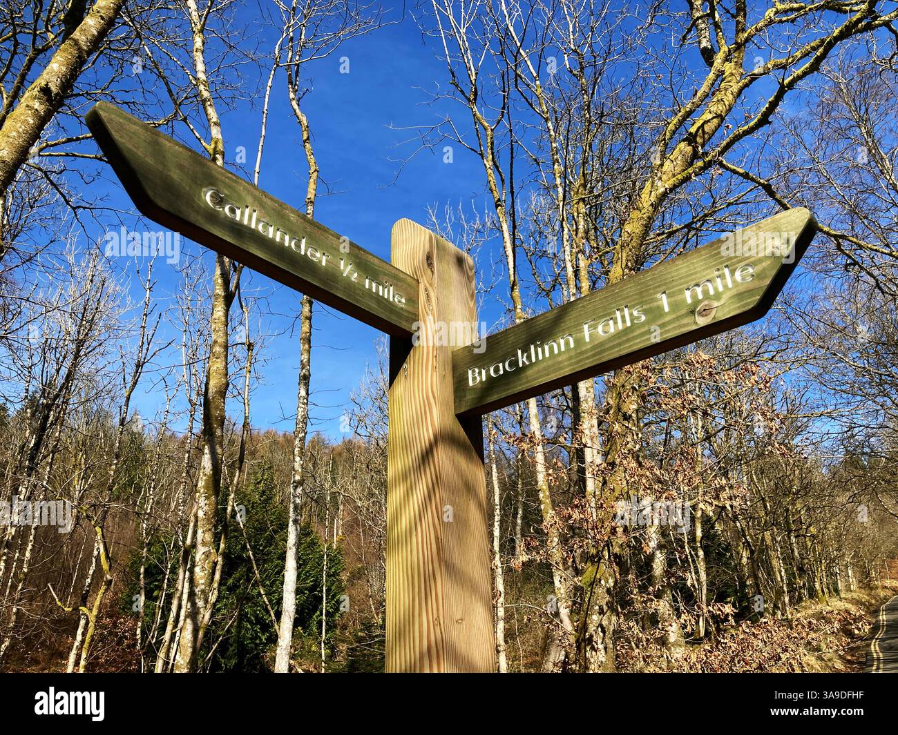 Directional Wooden fingerpost for Callander and The Bracklinn Falls, Callander Scotland Stock Photo