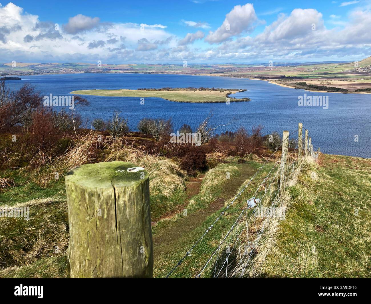 View of RSPB Loch Leven National Nature Reserve and St. Serfs island from Vane Hill on one of the walking trails, Kinross Scotland Stock Photo