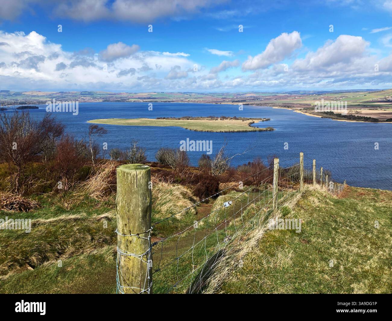 View of RSPB Loch Leven National Nature Reserve and St. Serfs island from Vane Hill on one of the walking trails, Kinross Scotland - Smartphone Captured Stock Image