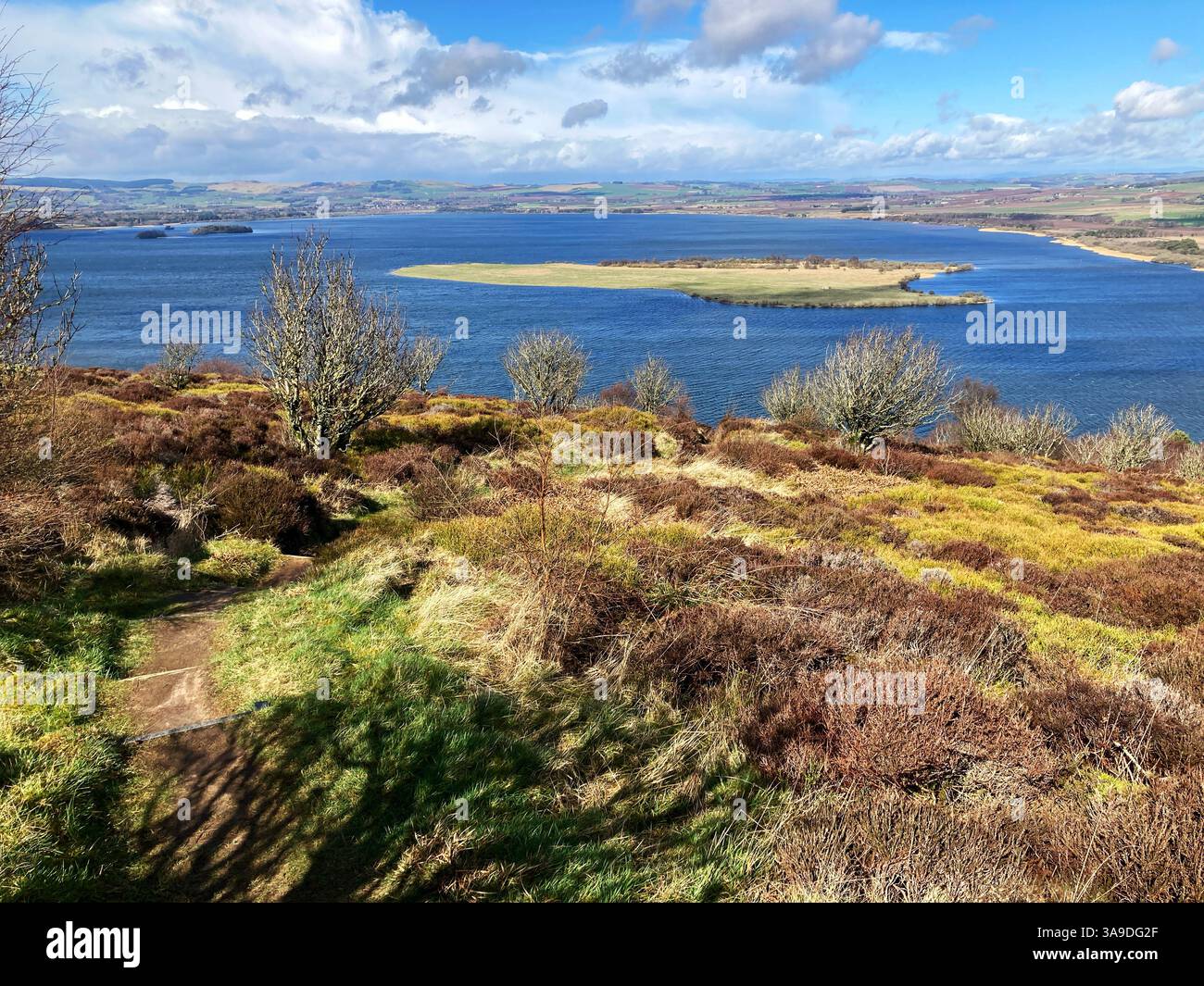 View of RSPB Loch Leven National Nature Reserve and St. Serfs island from Vane Hill on one of the walking trails, Kinross Scotland Stock Photo
