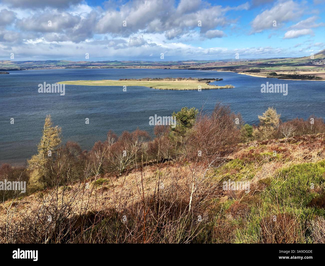 View of RSPB Loch Leven National Nature Reserve and St. Serfs island from Vane Hill on one of the walking trails, Kinross Scotland - Smartphone Captured Stock Image