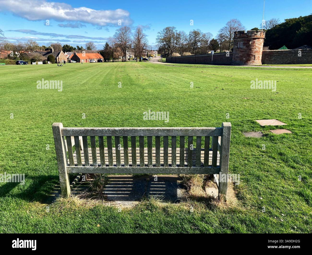 Village Green at Dirleton, with a view of the castle walls, East Lothian Scotland - Smartphone Captured Stock Image