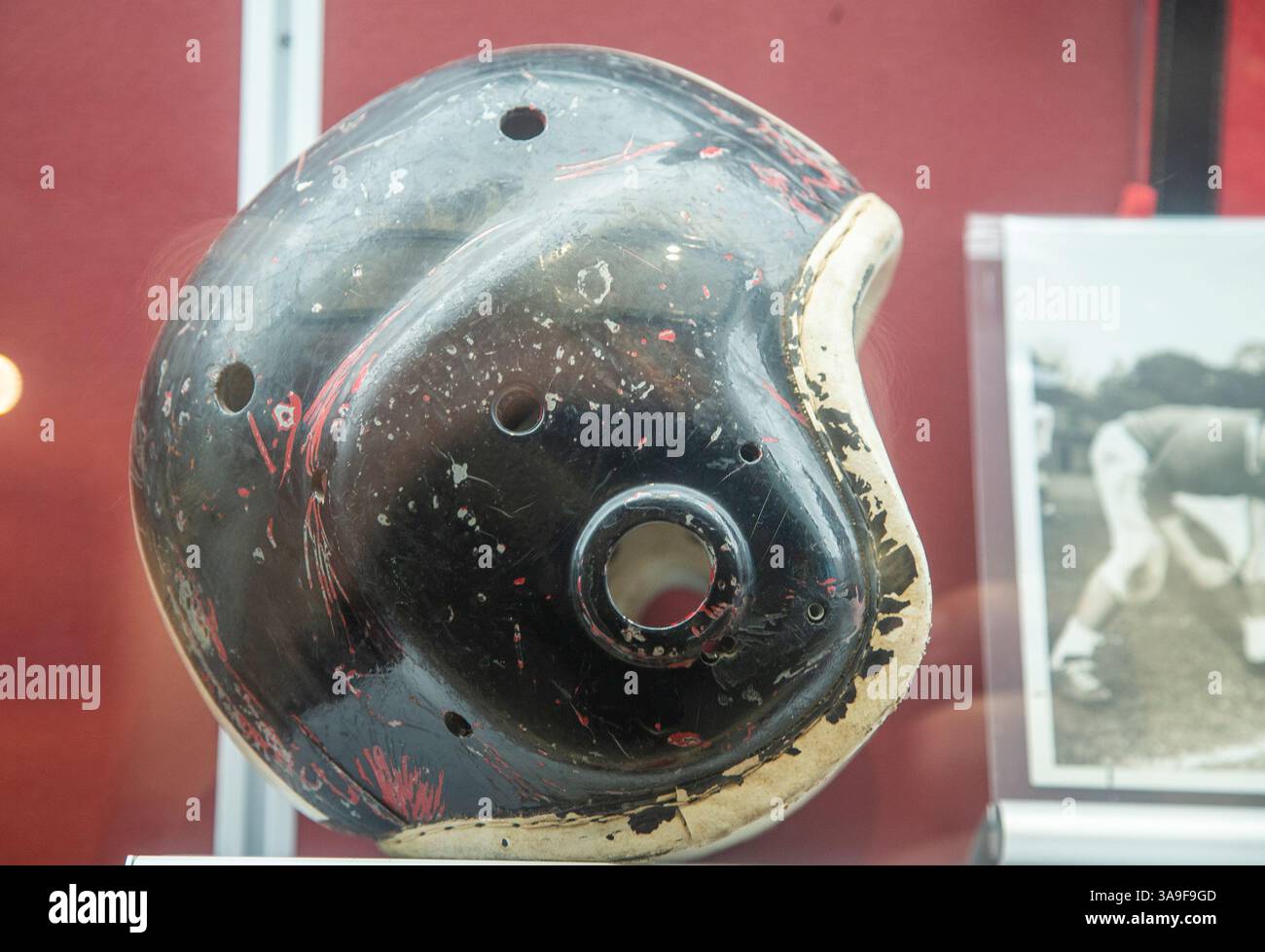 An old football helmet at the Charles J. Muth Museum in Patterson, NJ Stock Photo