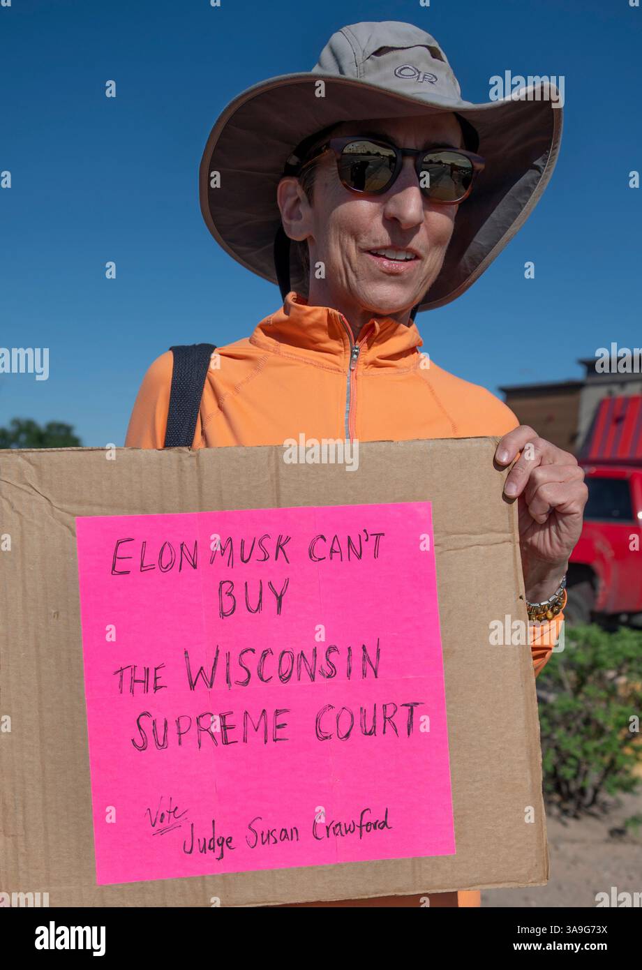 Protesters with placards deriding Elon Musk and Trump Administration's ...