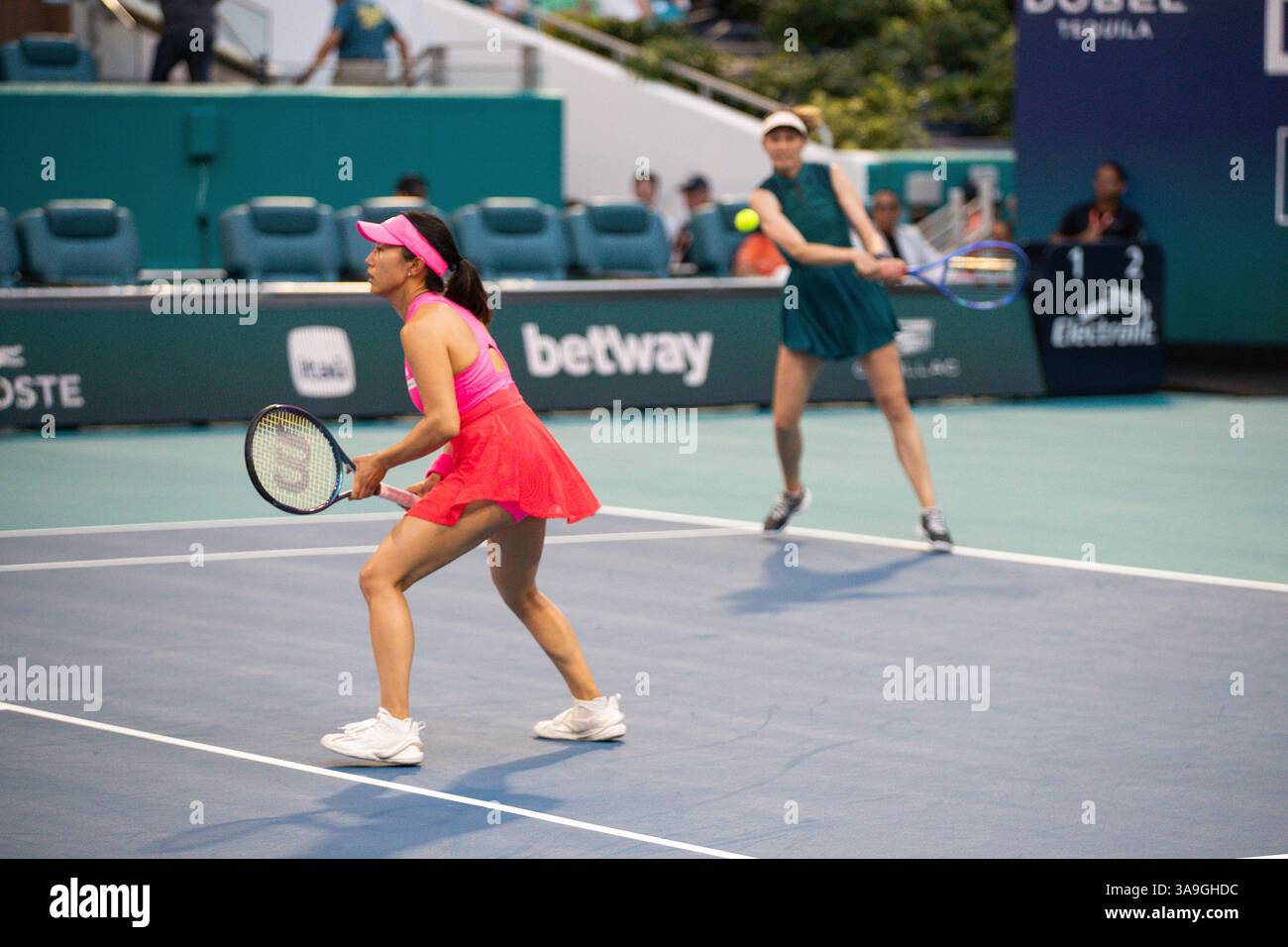 Cristina Bucsa of Spain and Miyu Kato of Japan return the ball in the ...