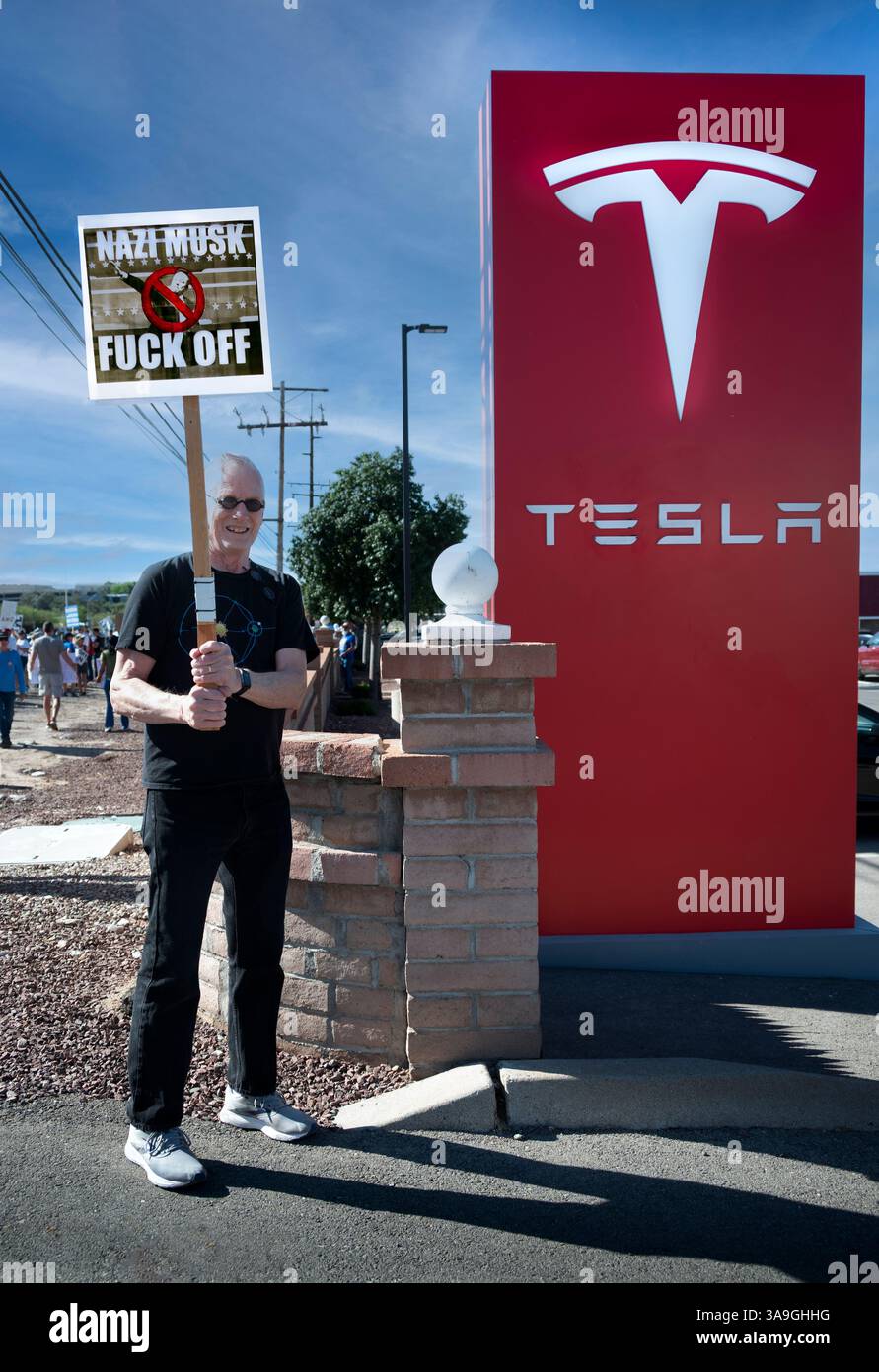 Protesters with placards deriding Elon Musk and Trump Administration's ...