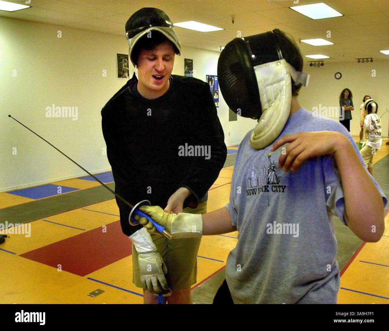 Instructor Simon Pitfield works with Sebastian Lawler, 12, Davis, at Davis Fencing Academy Wednesday April 10, 2002.  Sacramento Bee / Owen Brewer  /ZUMA Press Stock Photo