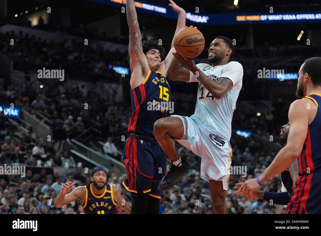 San Antonio Spurs guard Blake Wesley (14) drives to the basket against