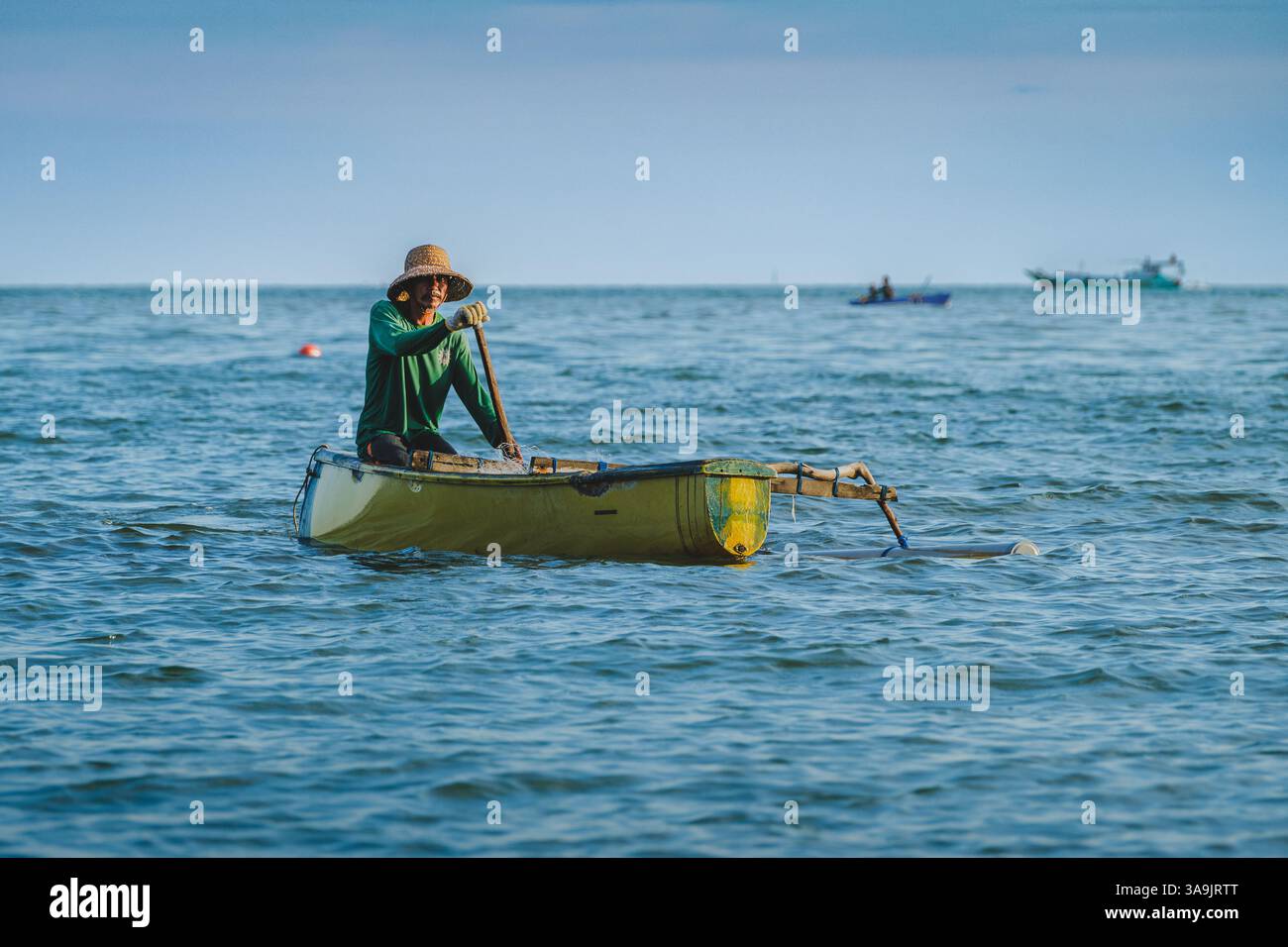 The fisherman is rowing home after fishing in the afternoon Stock Photo ...