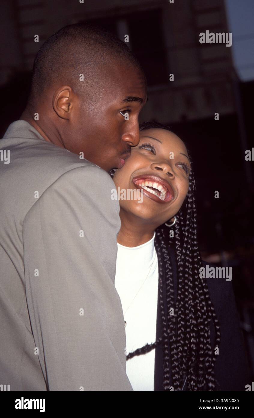 Jun 11, 1996; Los Angeles, CA, USA; Basketball star KOBE BRYANT kisses
