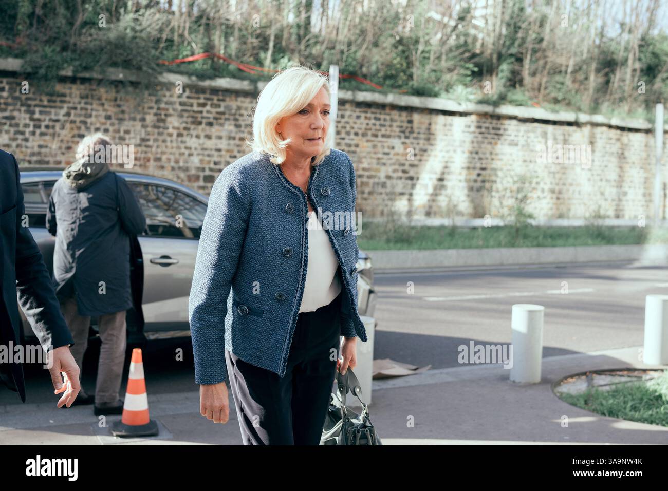 Paris, France. 31st Mar, 2025. President of the parliamentary group of the French far-right Rassemblement National (RN) party, Marine Le Pen arrives at the Paris courthouse for her trial verdict on suspicion of embezzlement of European public funds, in Paris, on March 31, 2025. A French court on March 31 will rule in the trial of far-right leader Marine Le Pen over an alleged fake jobs scam at the EU parliament, a verdict which could ruin her chances of standing in the next presidential elections in two years. Photo by Alexis Jumeau/ABACAPRESS.COM Credit: Abaca Press/Alamy Live News Stock Photo