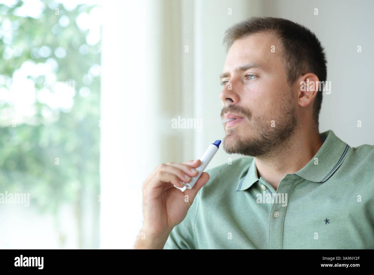 migo vapes Cool man vaping Stock Photos, Royalty Free Cool man vaping Images main image 0