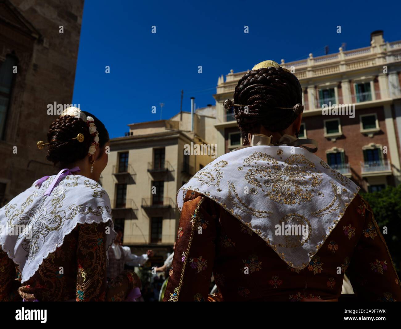 Women dressed in the traditional Fallera attire, also known as the ...