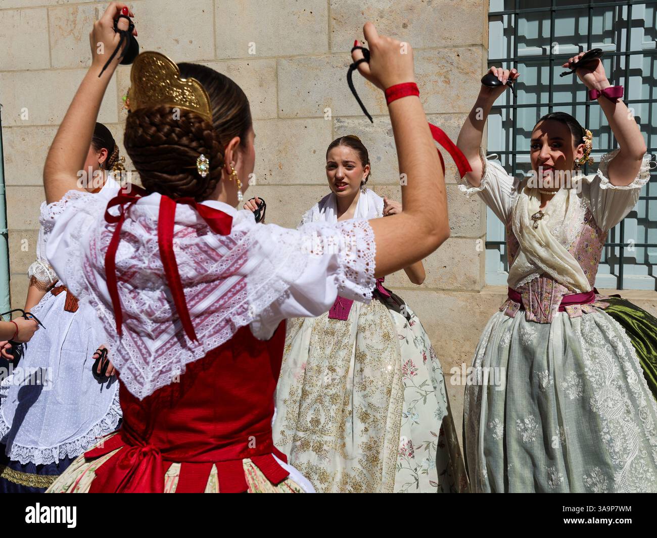 Women dressed in the traditional Fallera attire, also known as the ...