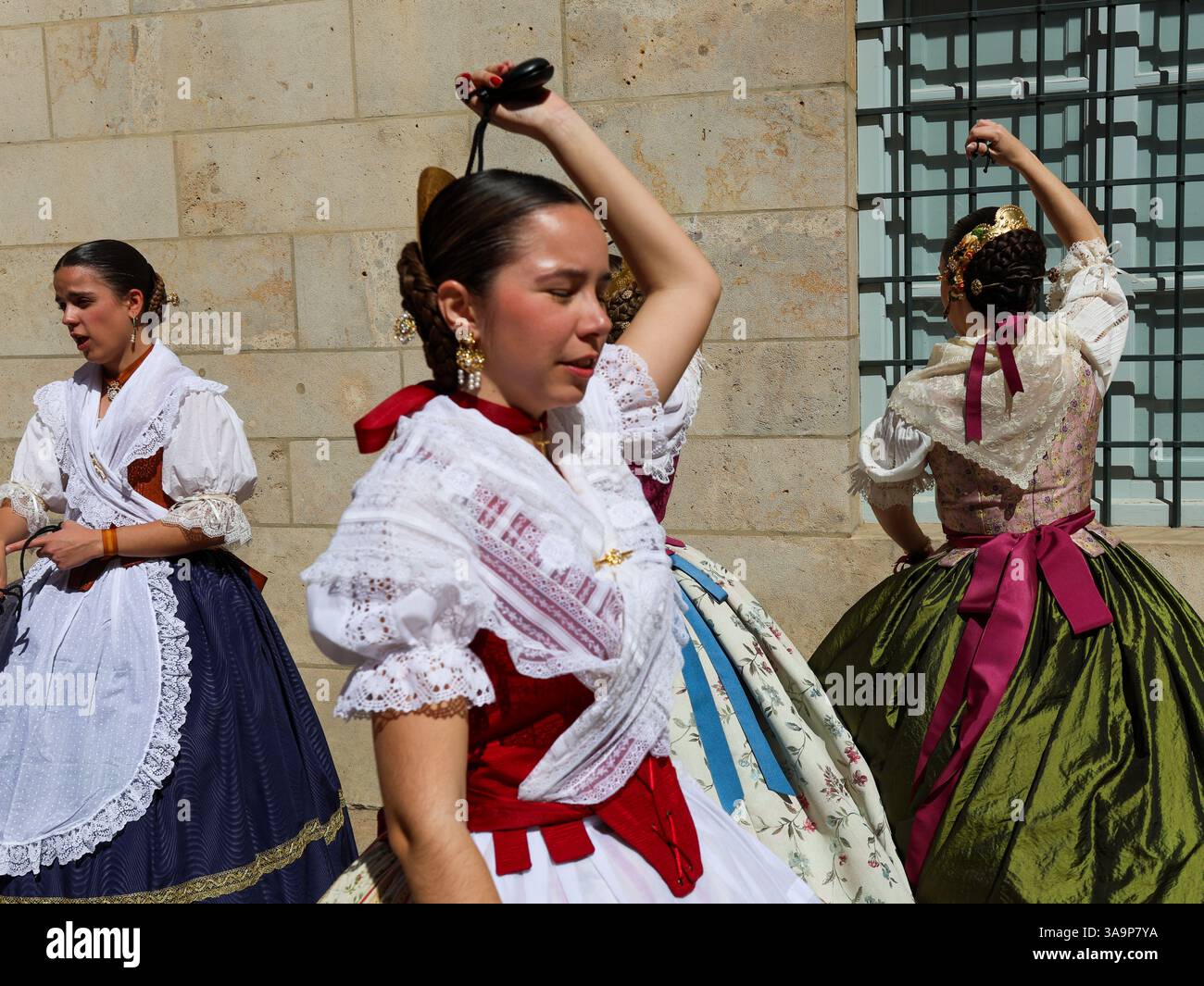 Women dressed in the traditional Fallera attire, also known as the ...