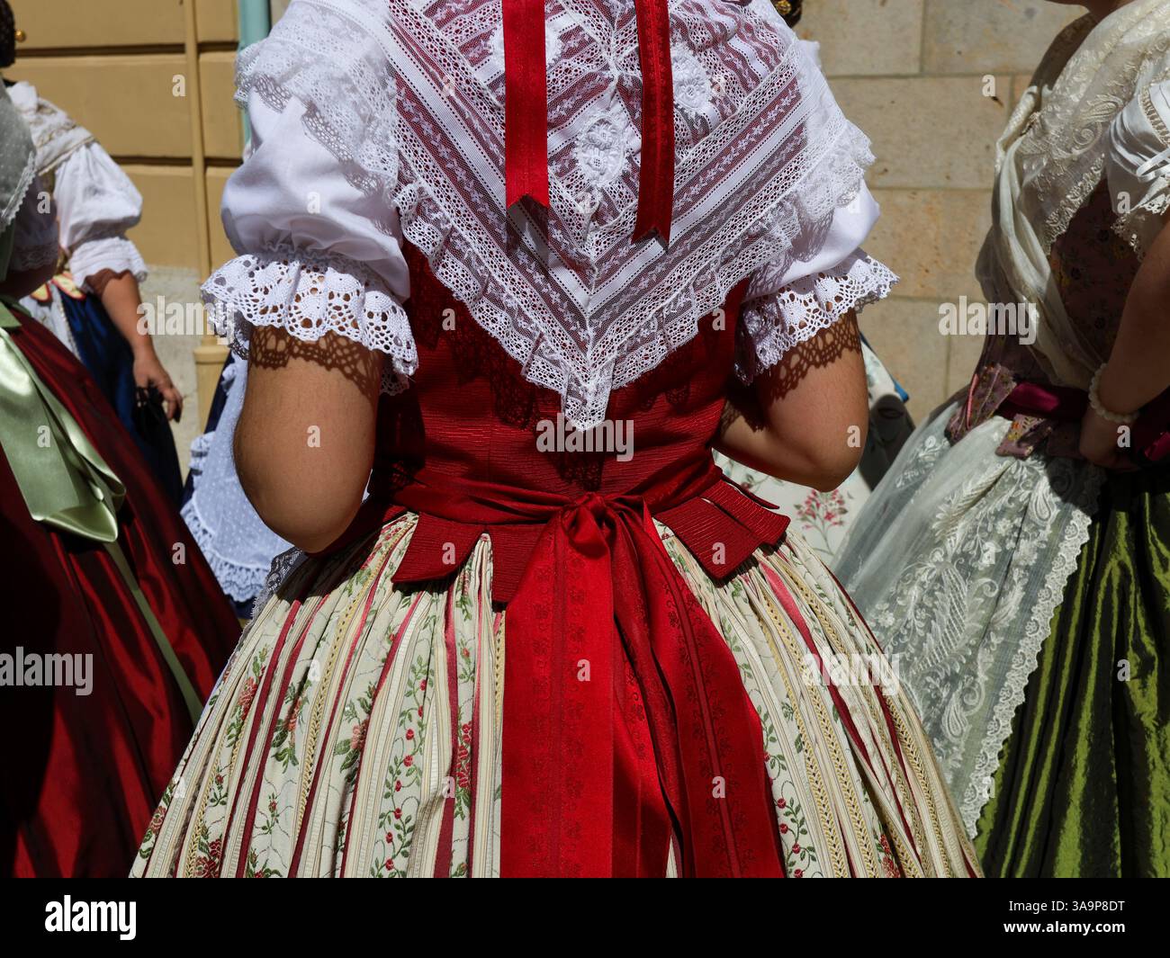 Women dressed in the traditional Fallera attire, also known as the ...