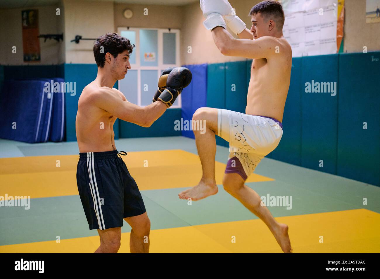Two athletes training together in a martial arts gym Stock Photo