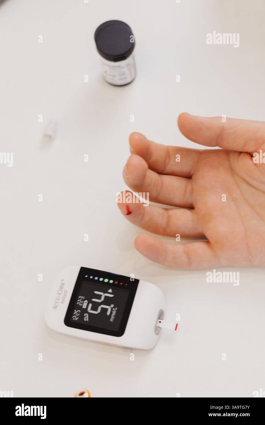 blood test for blood glucose level in a patient Stock Photo
