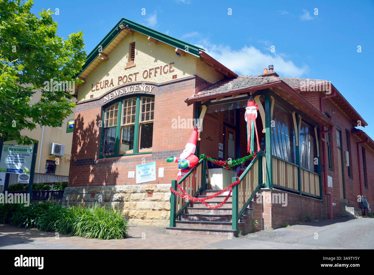 Leura, New South Wales, Australia – December 4, 2015. Post office building in Leura, NSW. View with billboards and New Year decorations. Stock Photo