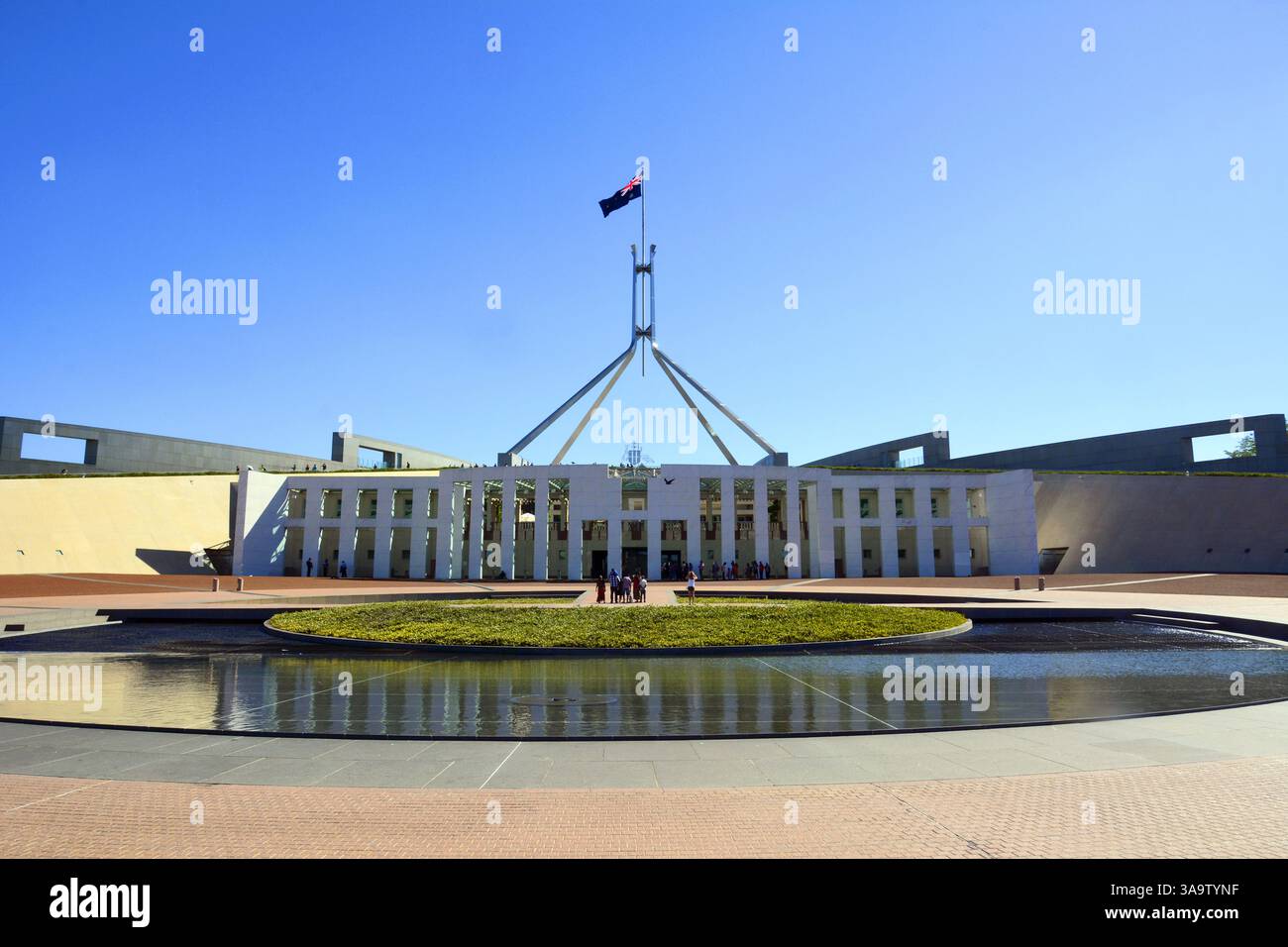 Canberra, Australia – December 29, 2015. New Parliament House in Canberra, Australia. The new Parliament building was opened in 1988. View with flagpo Stock Photo