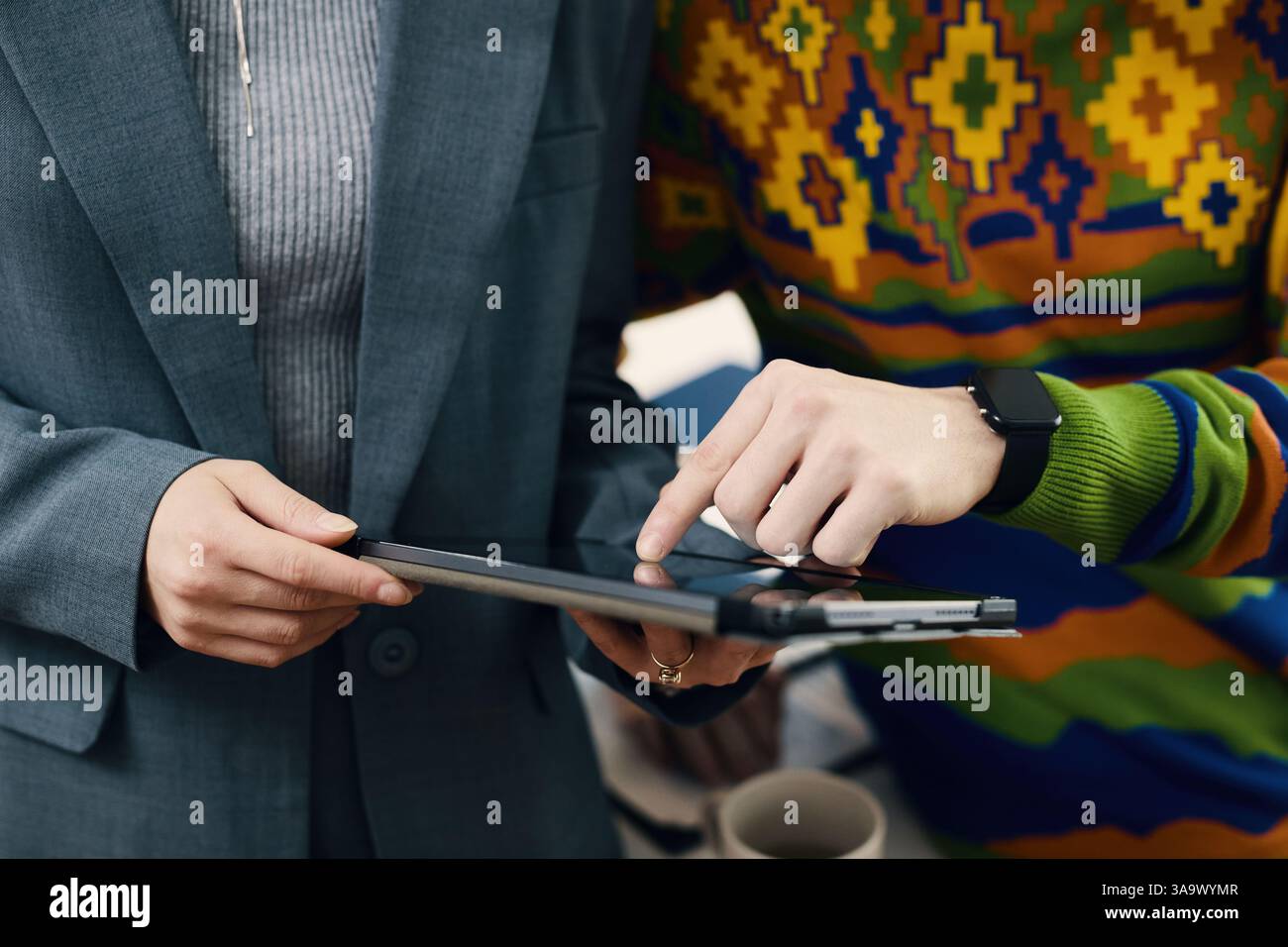 Colleagues Using Digital Tablet In Team Stock Photo