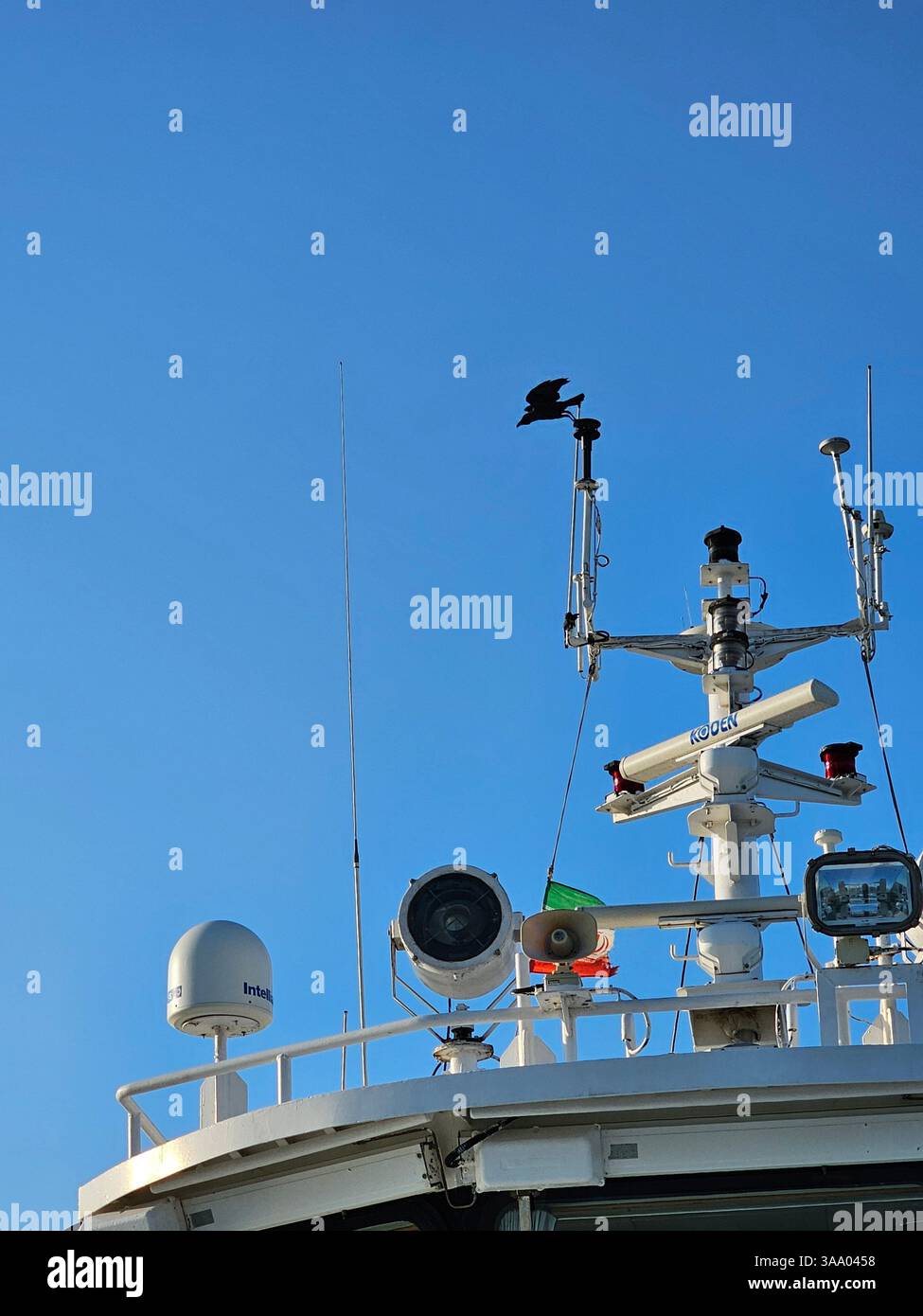 Option 1 (Focus on Detail): A detailed view of a boat's hull, showcasing its vibrant blue and red paint, along with essential nautical equipment like - Smartphone Captured Stock Image