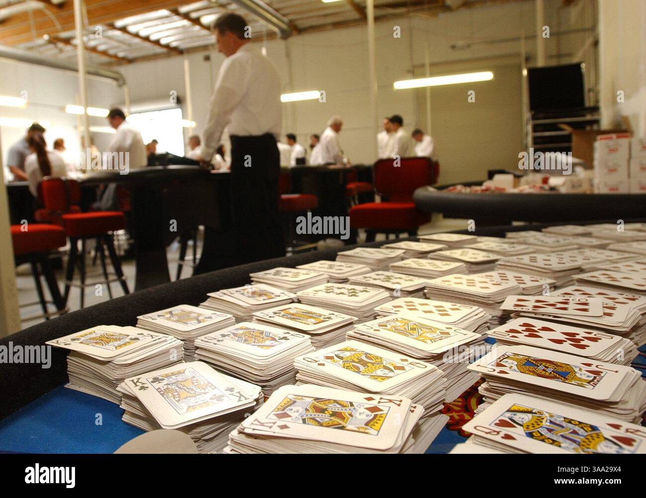 --  Saturday, March 15, 2003, Rocklin, Calif. --  Decks of playing cards partially cover a table as Thomas Dean, passes cards at the Thunder Valley CAsino Dealer School Saturday. The cards will become a large part of Dean's life once he becomes a dealer for Thunder Valley Station Casion in PLacer County, after being unemployed for more than a year. ( The Sacramento Bee Hector Amezcua )/ZUMA Press Stock Photo