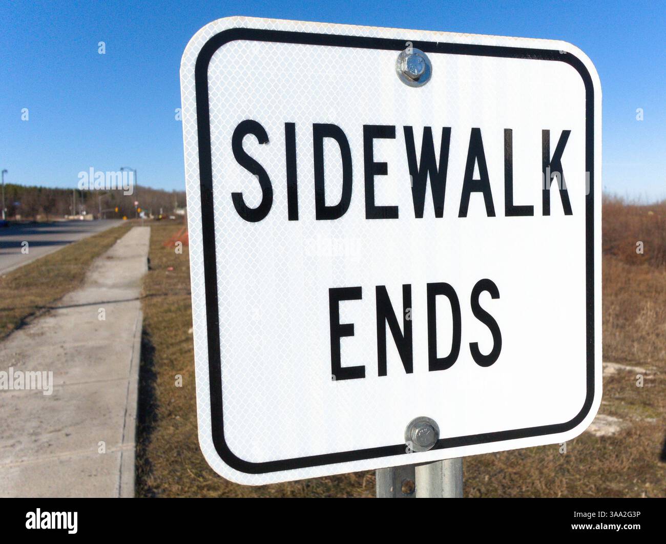 A symbolic reminder of transitions and endings, this sidewalk sign ...